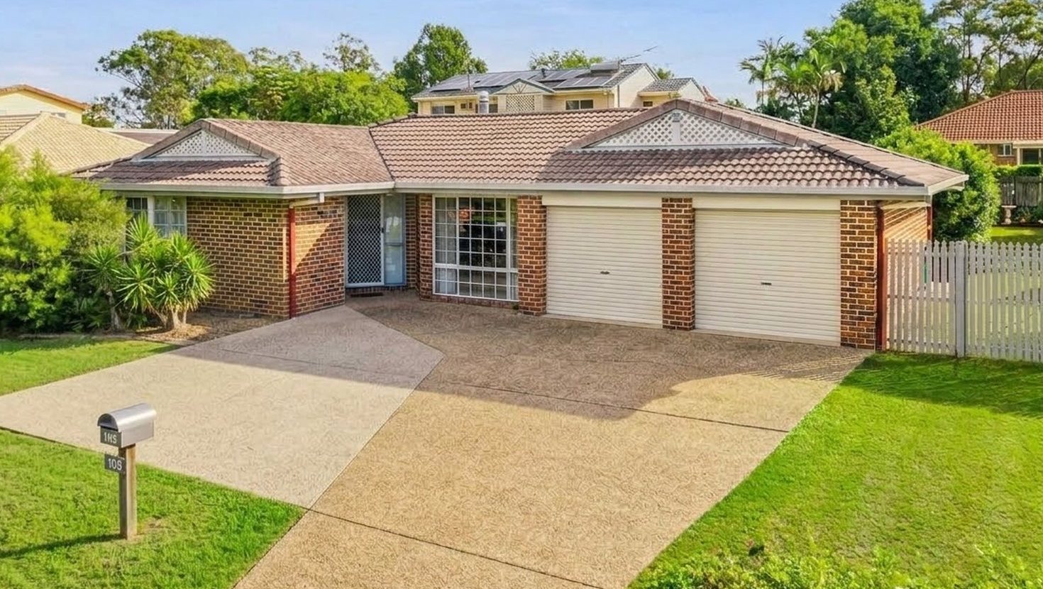 Brick home with its original weathered concrete tile roof